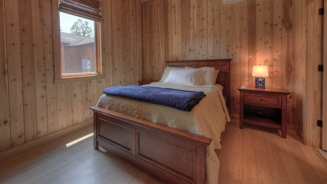 Spacious bedroom overlooking breezeway. 