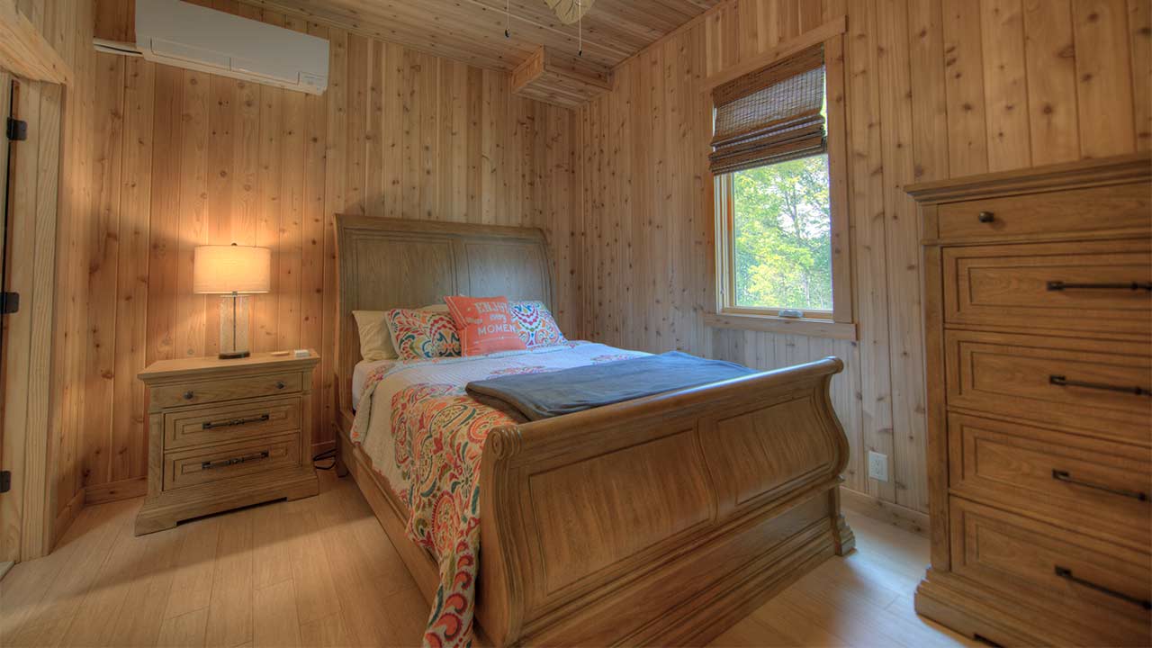 Large bedroom overlooking pond.