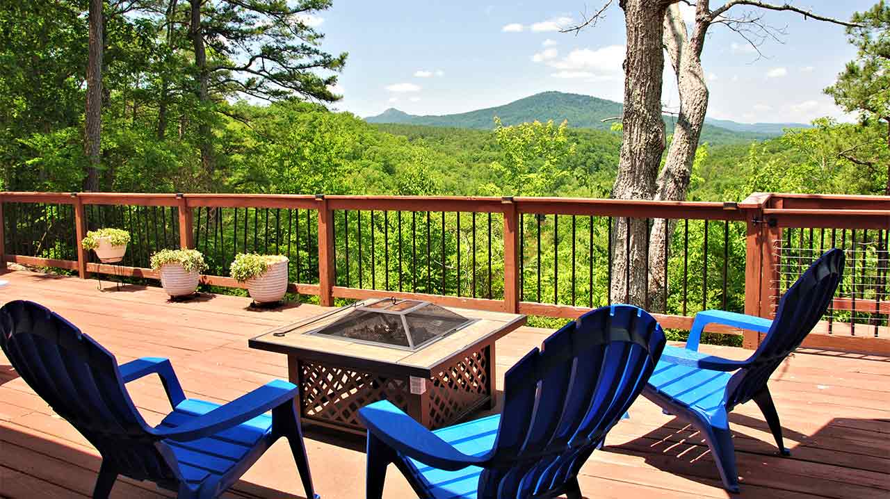 Spacious deck with lots of seating and firepit.