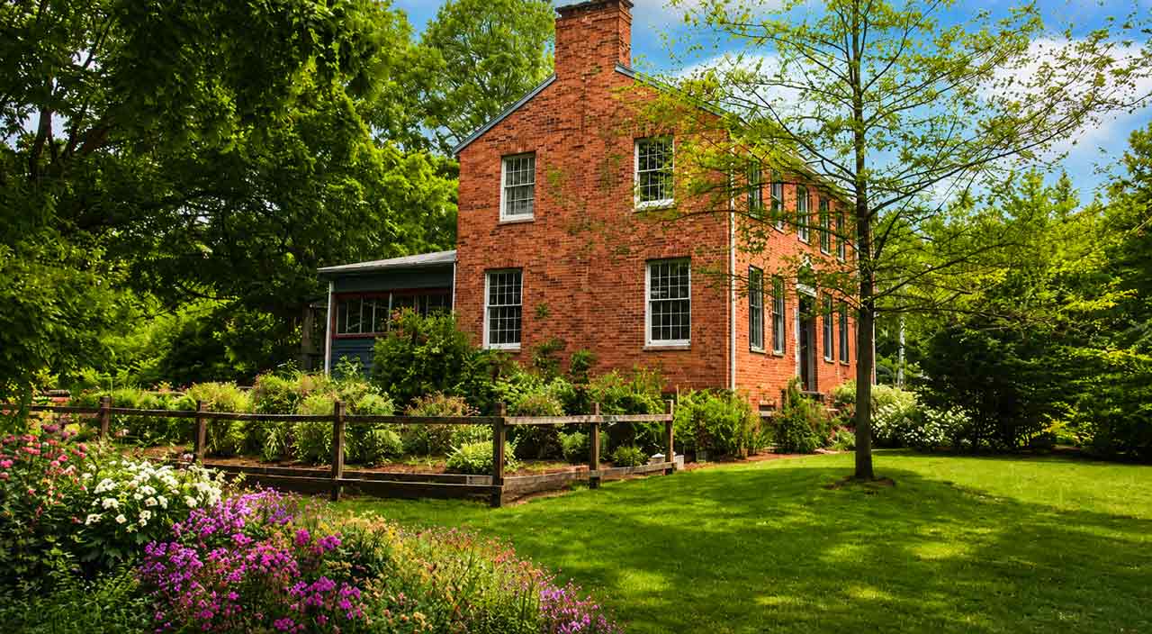 Fluvanna County country estate with gardens, mature trees, open land, and a private rural setting